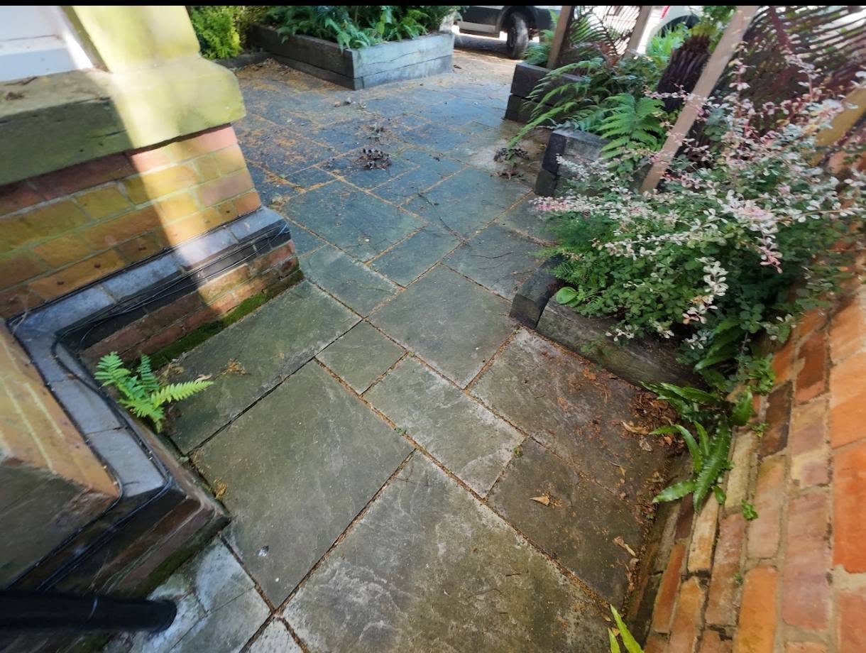 weathered sandstone path before professional cleaning
