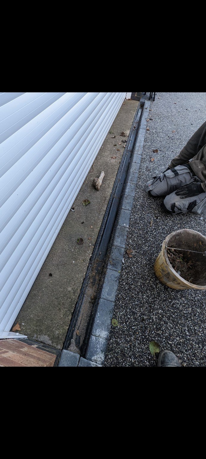 Low-level channel gutter cleared of leaves and debris by RMS