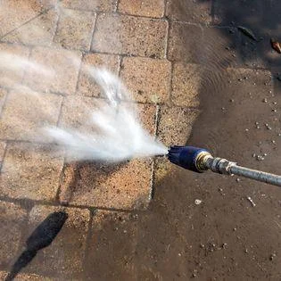 pressure washing equipment cleaning paving