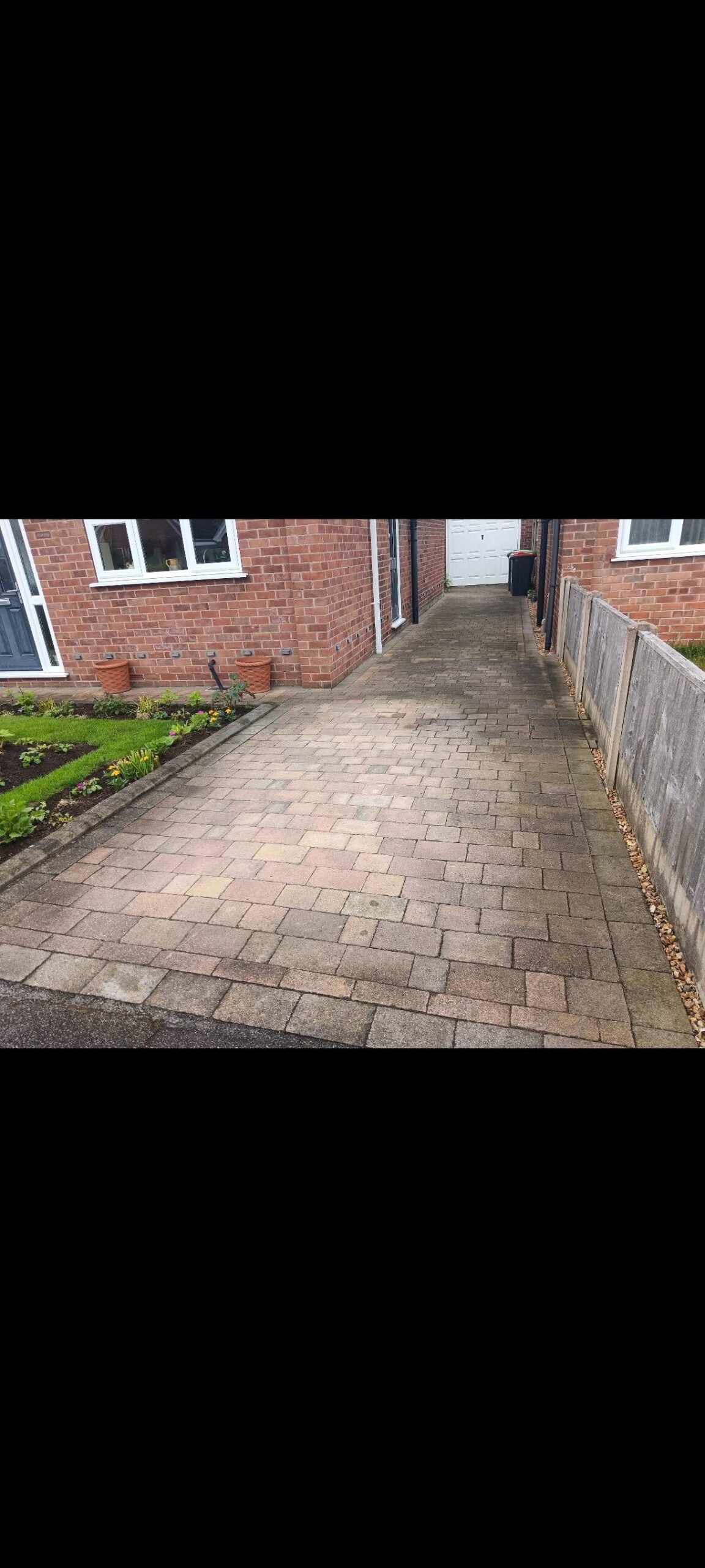 Hucknall block-paved driveway before cleaning, showing dark surface build-up
