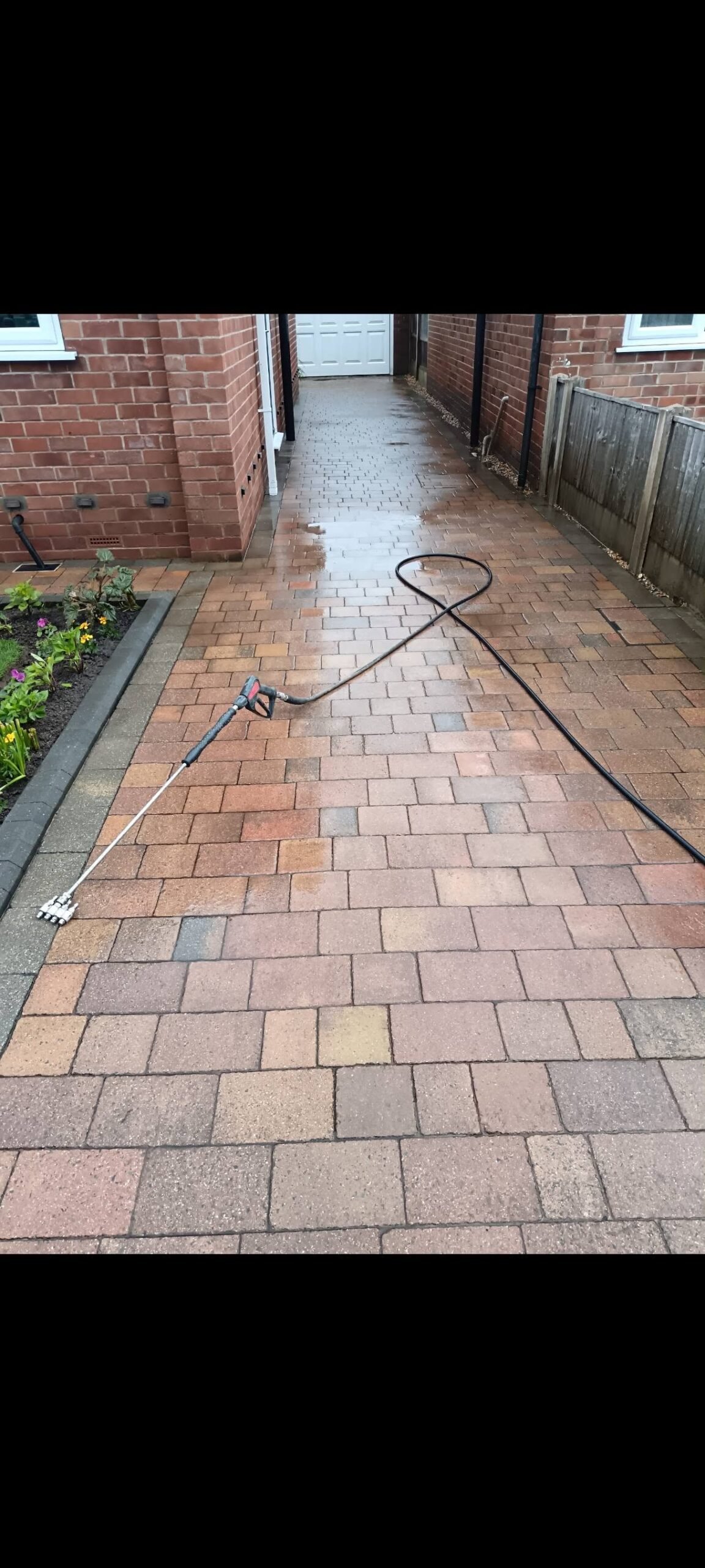 Hucknall block-paved driveway after pressure cleaning, with the paving still wet