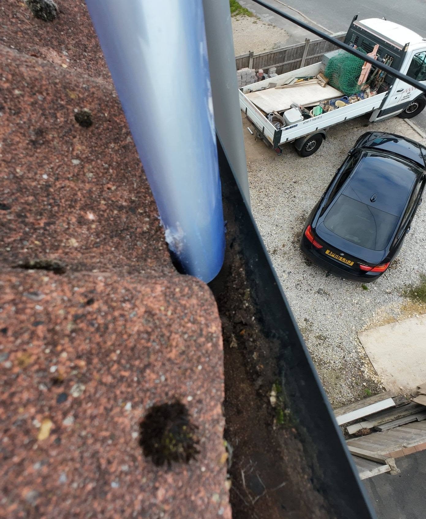 RMS vacuum nozzle clearing debris from the gutter